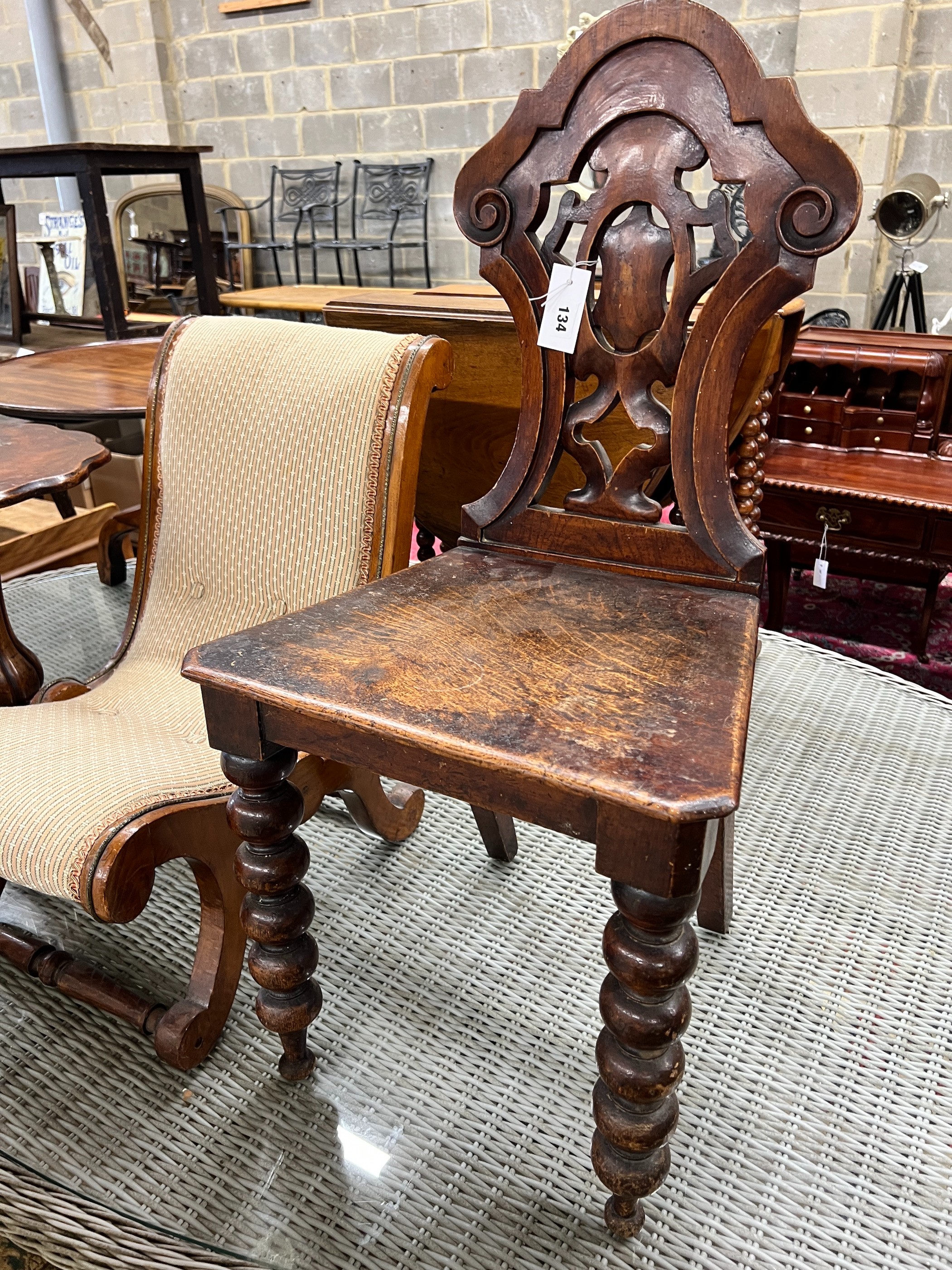 A Victorian oak and mahogany hall chair, a slipper chair and a wine table